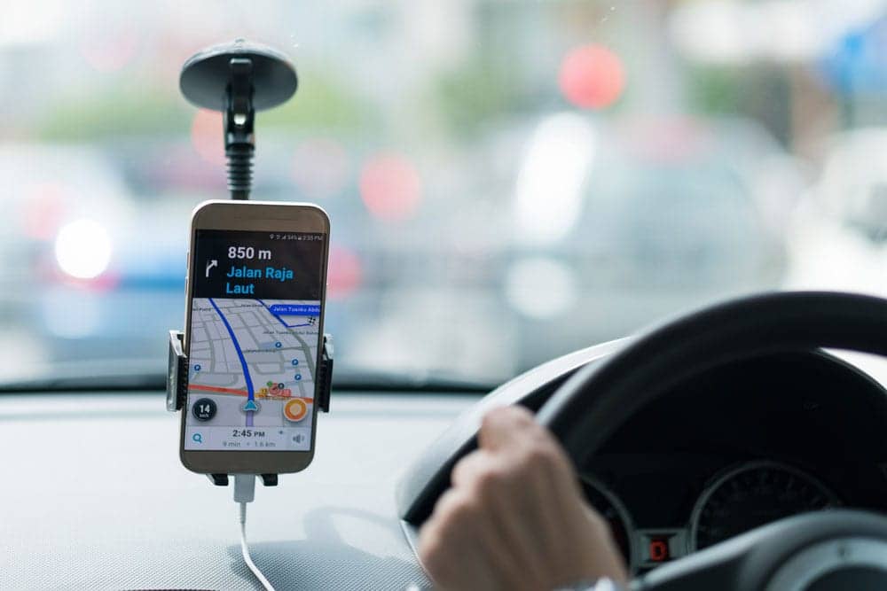 gps positioned on ride share driver's windscreen